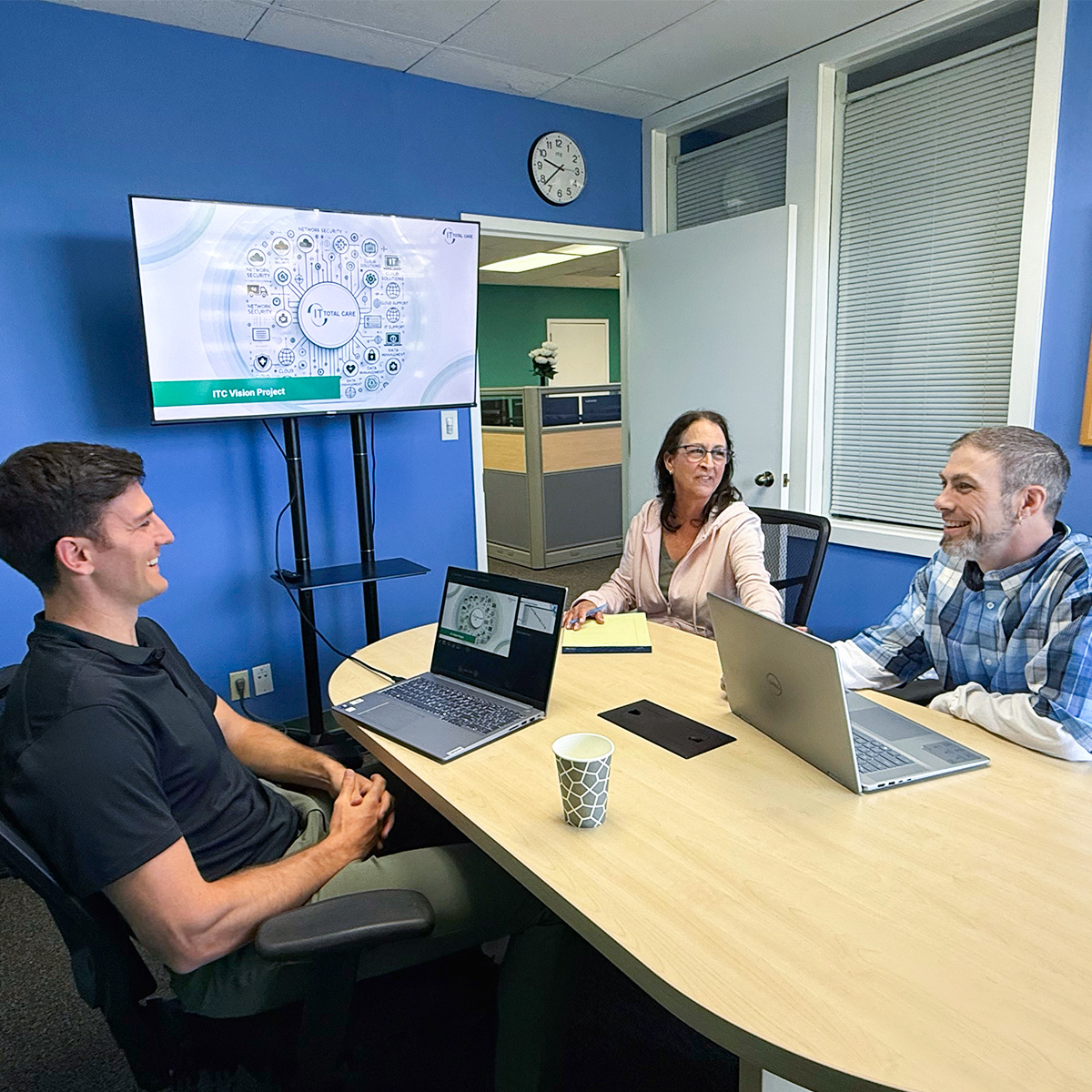 IT professionals collaborating during team meeting at managed services company
