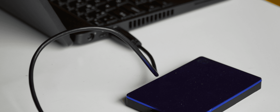External hard drive connected to laptop for data backup and recovery — IT Managed Services Provider in San Francisco Bay Area