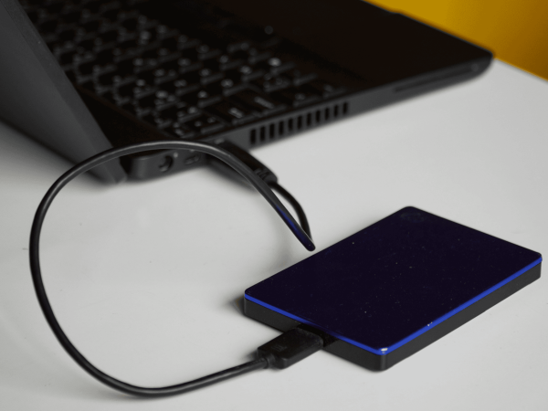 External hard drive connected to laptop for data backup and recovery — IT Managed Services Provider in San Francisco Bay Area