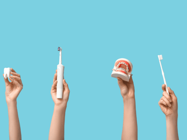 Dental care tools including tooth model braces electric toothbrush and manual toothbrush representing modern dental technology supported by secure IT systems