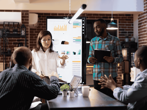 Technology business review meeting focused on IT strategy, performance metrics, and long term planning