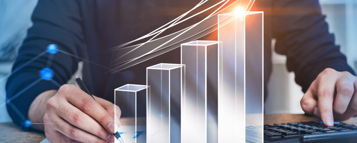 Accountant at work in office, growing graph