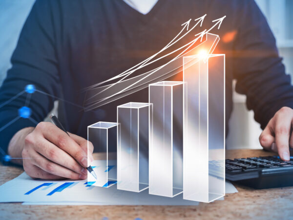 Accountant at work in office, growing graph