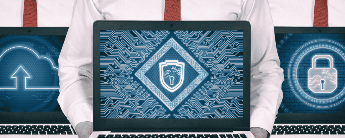 Laptop displaying cybersecurity shield and encryption graphics representing data protection and network security for healthcare organizations