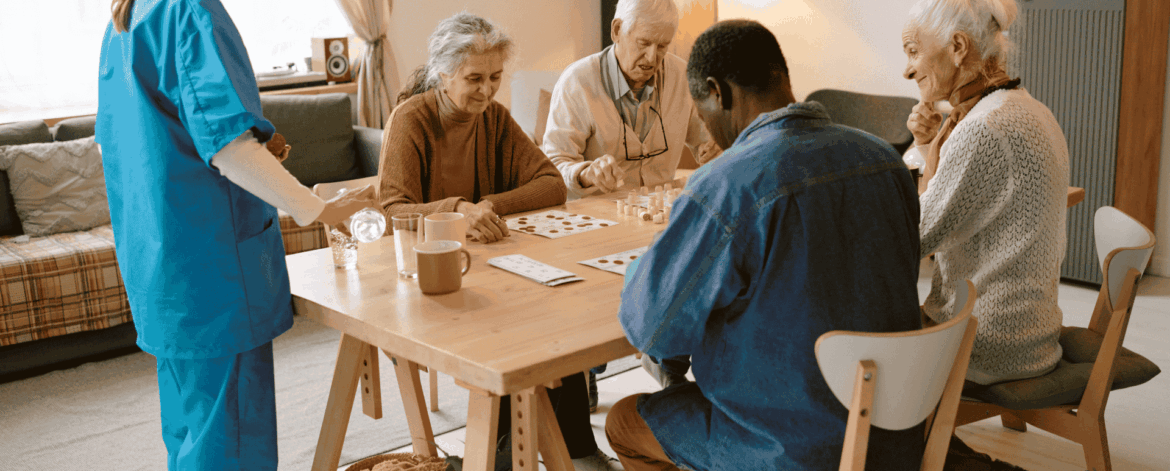 Caregiver assisting elderly patient with mobility in home highlighting importance of securely backing up patient data in cloud-based healthcare systems.