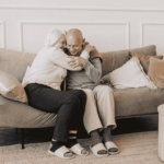 Senior couple embracing at home representing trust and importance of safeguarding sensitive patient information through secure cloud backup solutions.