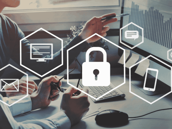Business professionals analyzing data on computers with security icons overlay highlighting endpoint detection and response monitoring devices and preventing cyber threats.