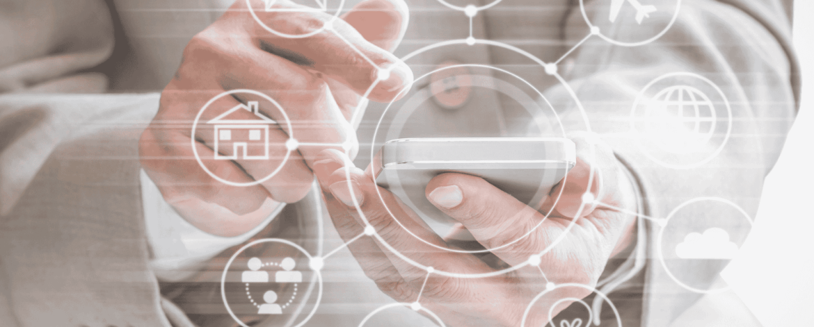 Business professional using a smartphone with digital app icons representing cloud computing, e-commerce, travel, and communication—illustrating mobile IT solutions for small businesses in the San Francisco Bay Area.