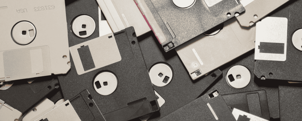 Stack of vintage floppy disks symbolizing data storage and IT history, highlighting secure data management and IT support services for San Francisco Bay Area businesses.