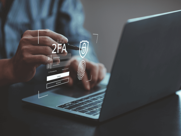 Two-factor authentication (2FA) login screen with fingerprint security on laptop – IT Managed Services Provider (MSP) in San Francisco Bay Area offering advanced cybersecurity solutions and secure access for small to mid-sized businesses.