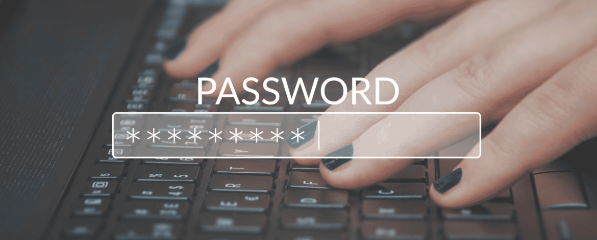 Unsafe password storage with sticky notes on laptop screen. IT Total Care helps San Francisco Bay Area businesses improve cybersecurity with password management and managed IT services.