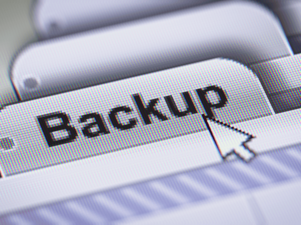 IT technician managing server rack for critical data backups. IT Total Care delivers managed IT services, data protection, and backup solutions for Bay Area SMBs.