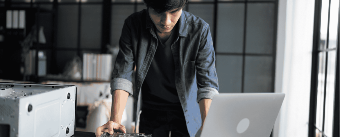 Woman making an online technology purchase using a tablet and credit card as part of a structured IT hardware acquisition process.