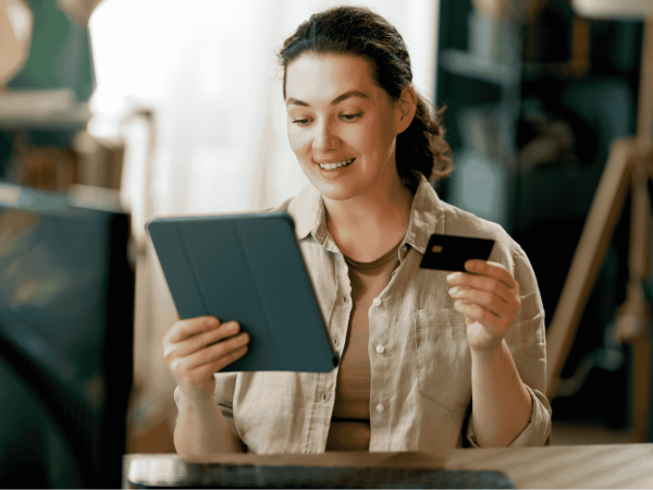 Technician assembling computer hardware components and reviewing specifications during the IT hardware procurement process.