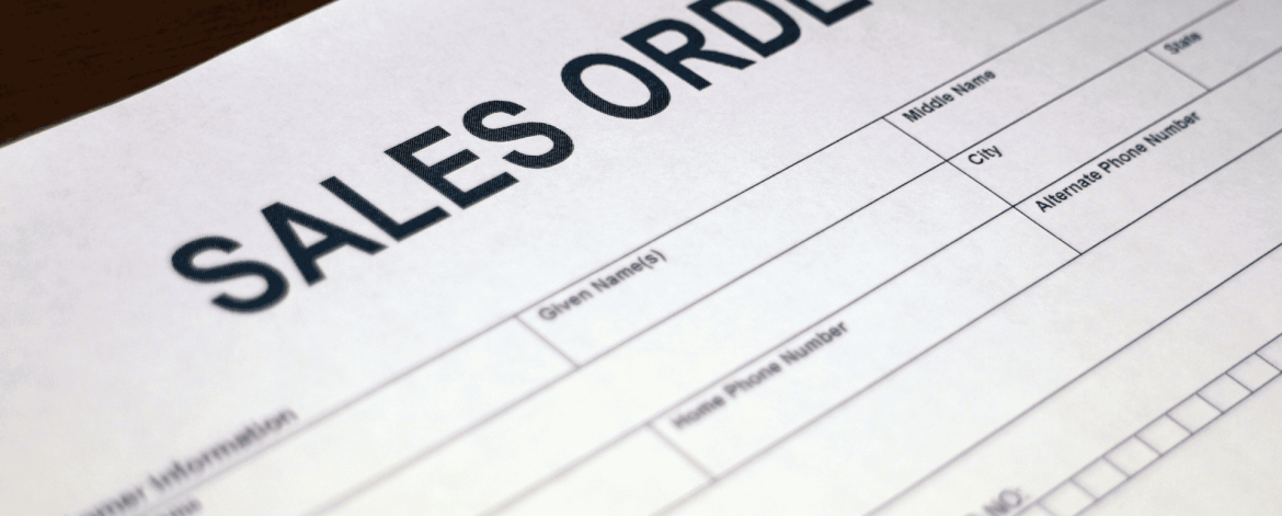Close-up of a sales order form used to document IT hardware purchases and track procurement details.