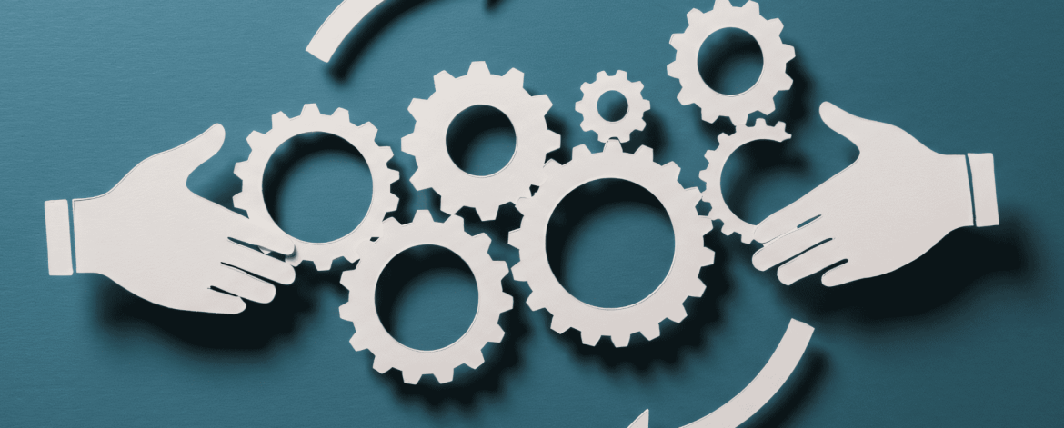 Hands exchanging interconnected gear icons symbolizing a coordinated IT hardware lifecycle management process with continuous improvement.
