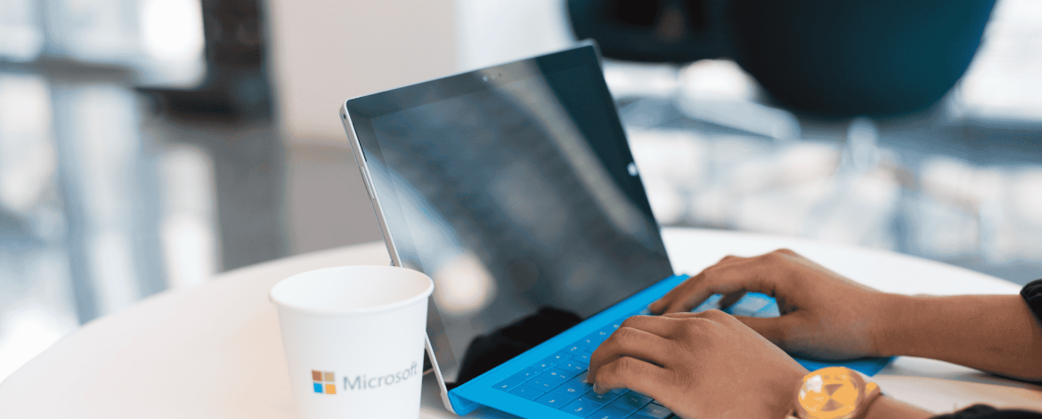 User signing into Microsoft Teams on a mobile device as part of Microsoft 365 adoption during a Microsoft Cloud migration.