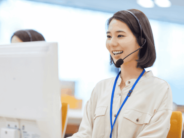 Business professionals collaborating with IT support staff to evaluate when to upgrade from family IT support to a managed service provider.