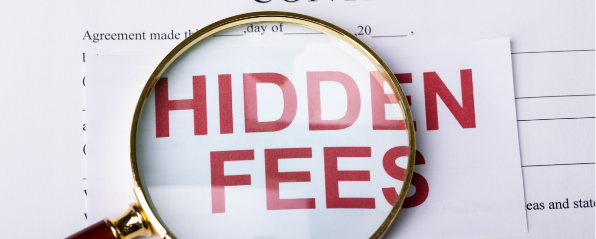 Magnifying glass over contract highlighting hidden fees in managed IT service agreements