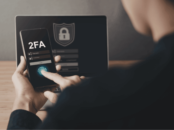 User logging into secure system with multi factor authentication on tablet and smartphone to protect healthcare data