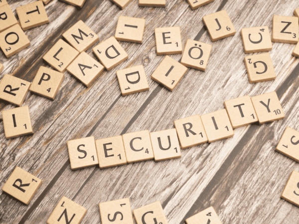 Scrabble tiles spelling security representing password management and cybersecurity awareness for home-based care organizations.