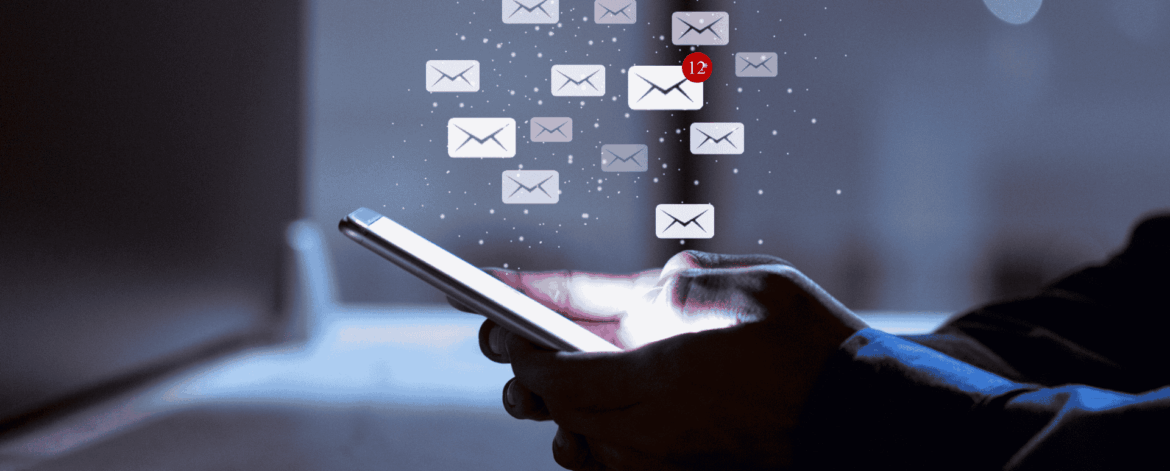 Smartphone displaying incoming email notifications highlighting risks of phishing attacks and importance of email security for businesses.