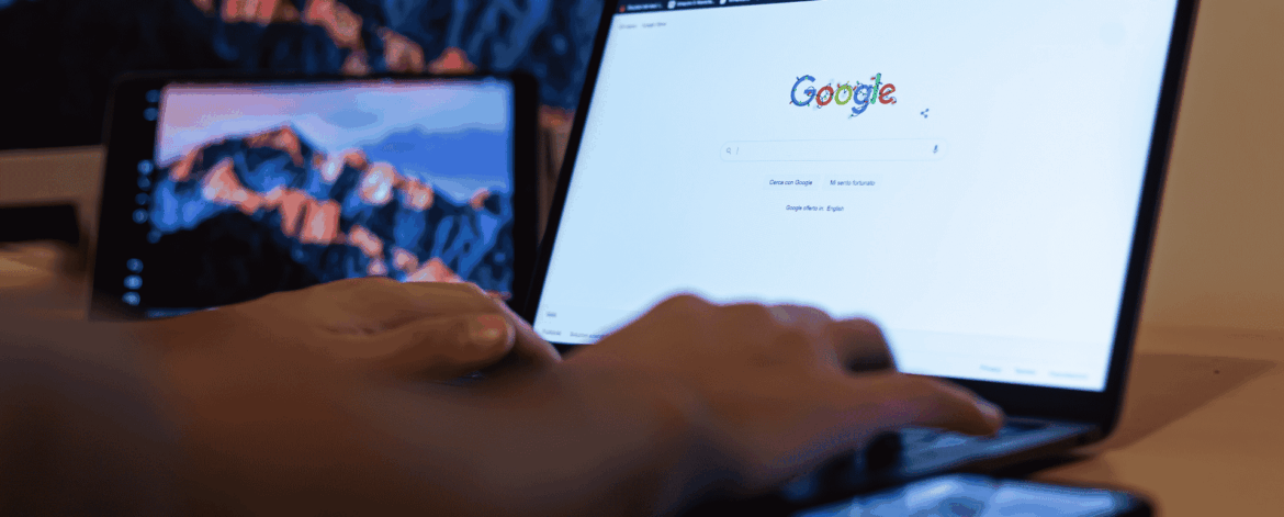 Google Workspace Best Practices for Home Based Care 2 Home care coordinator using Google Workspace on a laptop and smartphone to manage client records and team communication, with multiple devices displaying Google on screen.