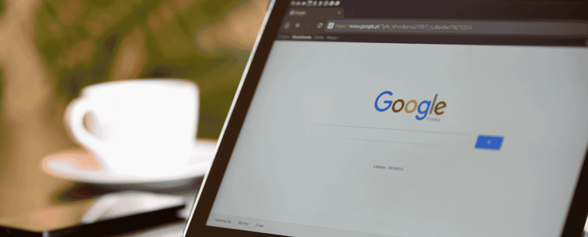 Samsung tablet propped on a desk showing the Google homepage alongside a coffee cup, representing how home care administrators use Google Workspace to organize files, manage permissions, and maintain HIPAA compliance.