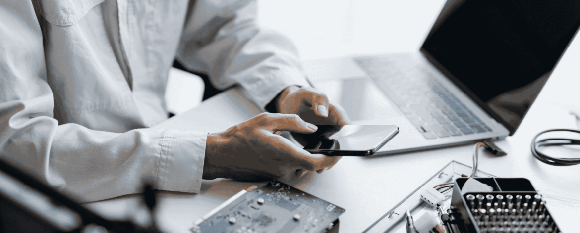 Hardware Lifecycle Management 2 Technician diagnosing and repairing computer hardware components, illustrating device maintenance, upgrades, and lifecycle management for business technology environments.