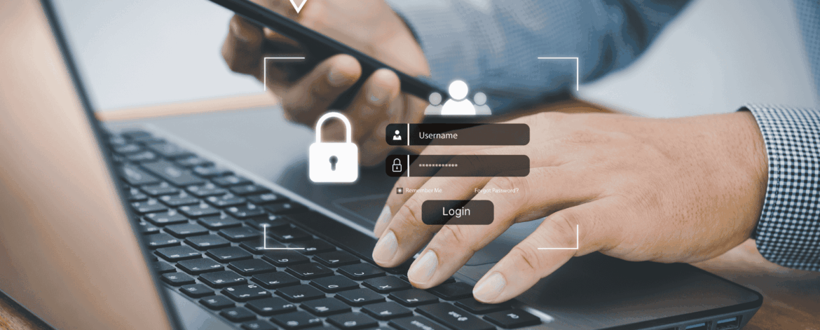Business professional using smartphone and laptop with secure login screen representing multi factor authentication for home-based care organizations
