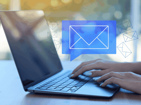 Person typing on laptop with secure email icon overlay representing encrypted communication and cybersecurity protection in home care.