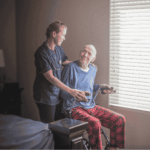 Home care provider supporting group of seniors during activity emphasizing need for reliable SaaS backup to protect care records and operational data.