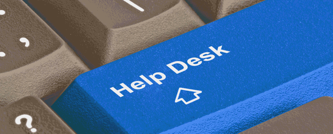 Close-up of a blue Help Desk key on a computer keyboard, the support path staff use when they need to send ePHI by encrypted email.