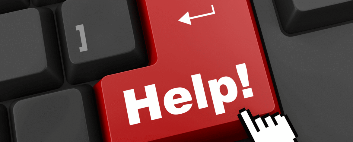 Image 2_10.7.26 Cursor clicking a red Help key on a black computer keyboard, the moment a hospice coordinator starts asking how to train hospice volunteers on HIPAA.