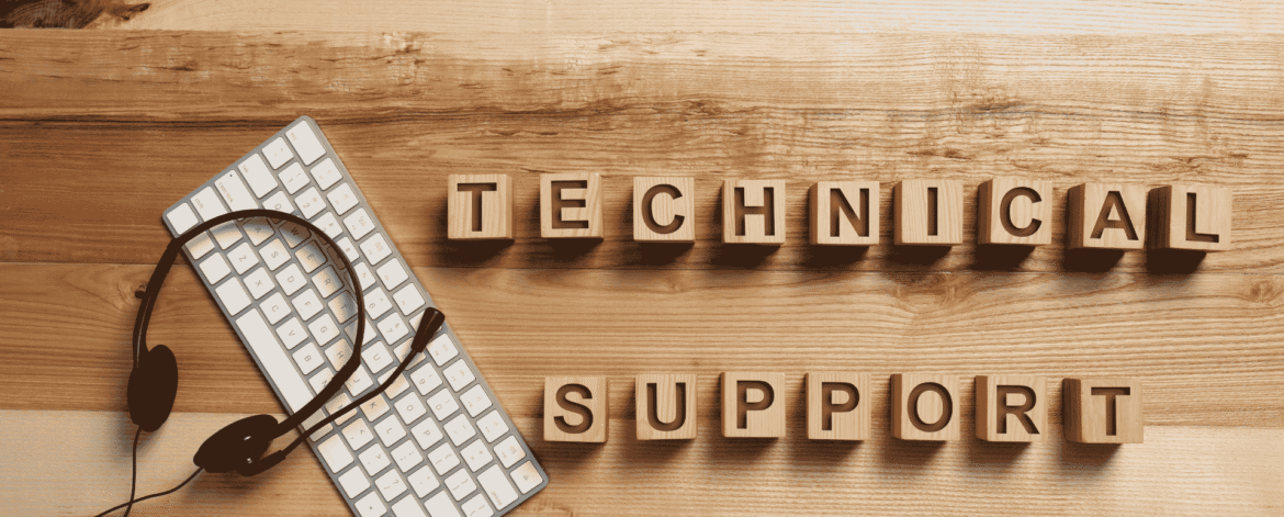 Wooden letter blocks spelling technical support beside a keyboard and headset, the help desk that fields questions like how long must a hospice keep patient records.